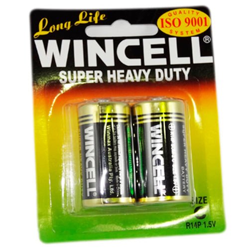 Four cylindrical wincell super heavy duty r14p 1.5v batteries with black and gold labeling in blister pack against gradient background