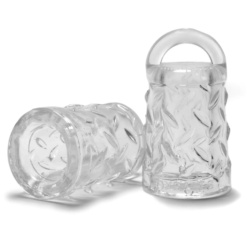 Clear transparent silicone cock ring with leaf-patterned design and integrated handle from nipple play collection.
