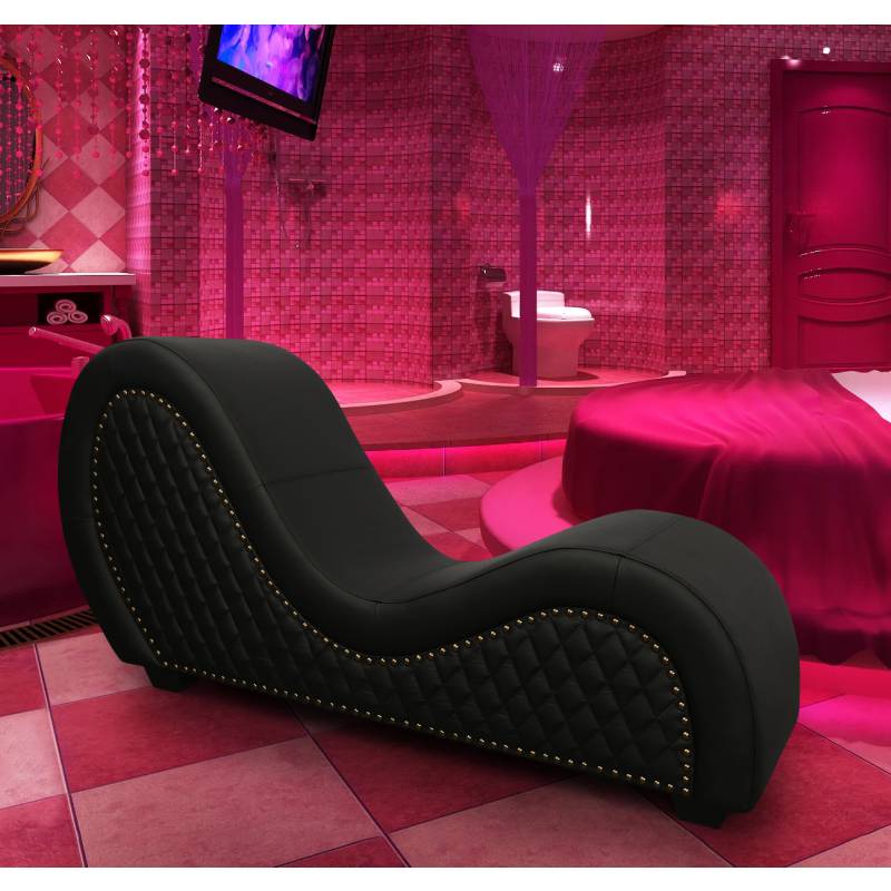Black quilted leather lounge chair with silver nailhead trim from sex furniture collection
