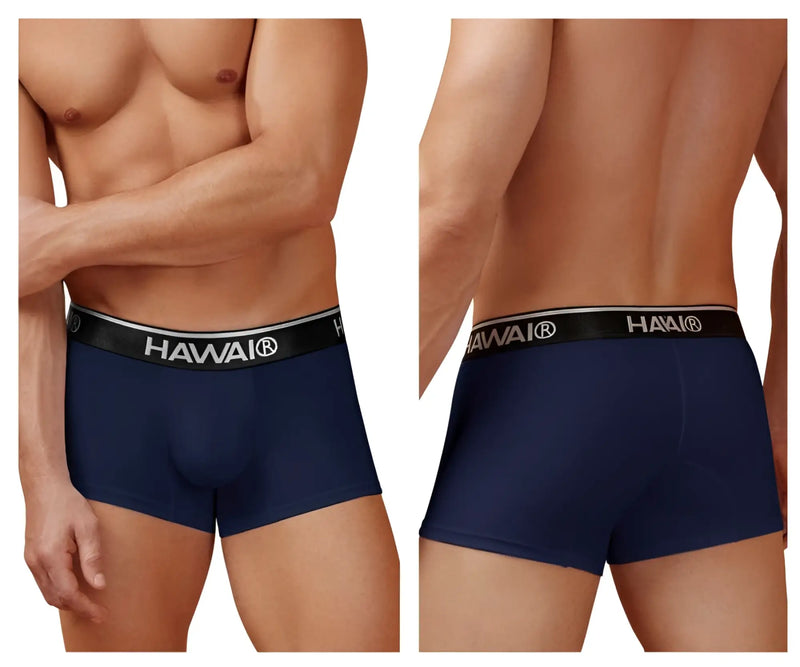 Model showcasing HAWAI Underwear in navy boxer briefs against a neutral background.