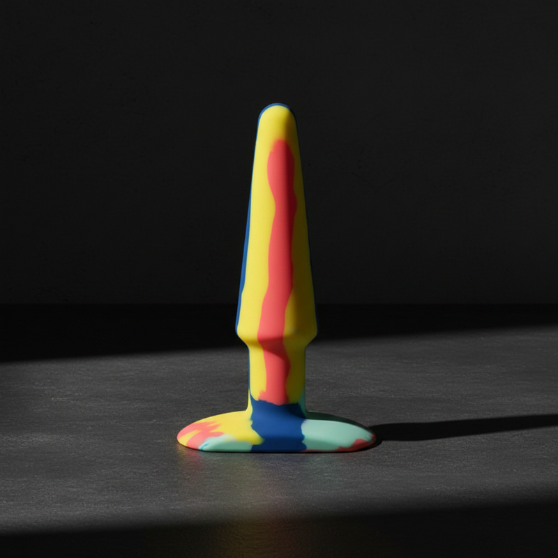 A-Play Groovy silicone anal plugs in Sunrise and Berry swirl colourways — bold, body-safe pleasure accessories.