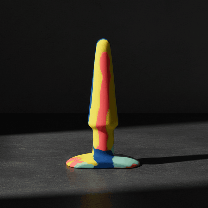 A-Play Groovy silicone anal plugs in Sunrise and Berry swirl colourways — bold, body-safe pleasure accessories.