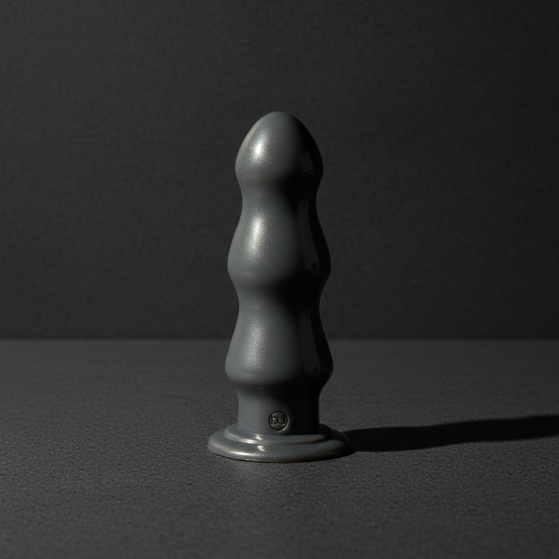 American Bombshell B-10 Warhead 10-inch gunmetal grey anal dildo with deep spiral ribbing and wide stable base.