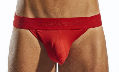 Red Cocksox jockstrap with smooth form-fitting fabric and elasticated waistband embossed with the Cocksox brand name.