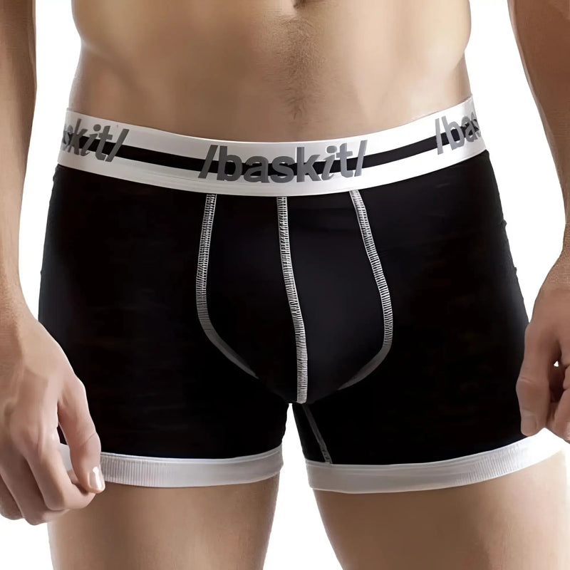 A man wearing black boxer briefs featuring white elasticated bands.