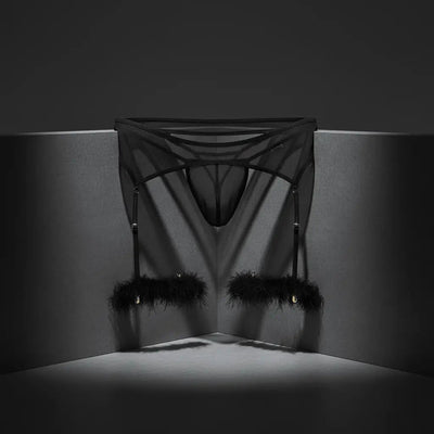 CandyMan Fashion men's underwear featuring a bold black design with feather accents against a dark background.