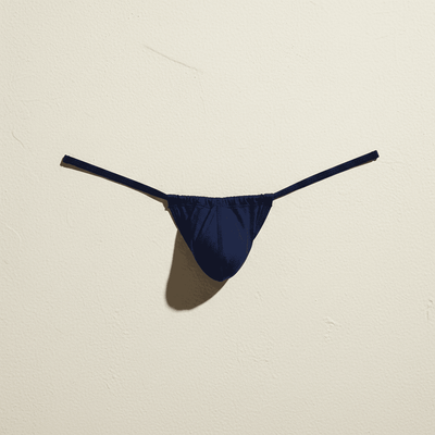A vibrant royal blue form-fitting swim brief from Cocksox made of smooth stretchy fabric with a sleek minimalist design