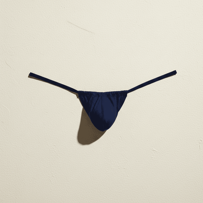 A vibrant royal blue form-fitting swim brief from Cocksox made of smooth stretchy fabric with a sleek minimalist design