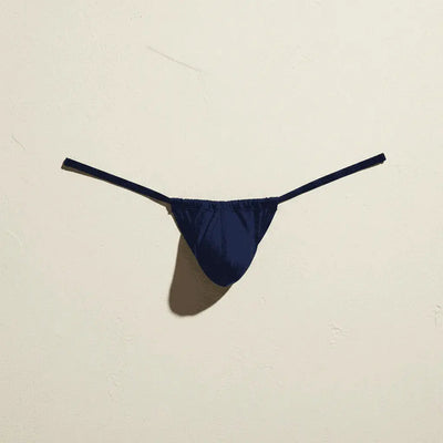 A vibrant royal blue form-fitting swim brief from Cocksox made of smooth stretchy fabric with a sleek minimalist design
