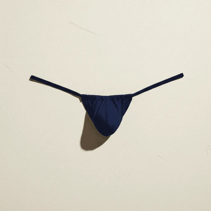 A vibrant royal blue form-fitting swim brief from Cocksox made of smooth stretchy fabric with a sleek minimalist design