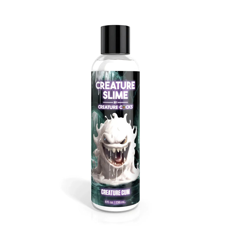 Clear plastic bottle with black cap containing liquid, white cartoon monster label.