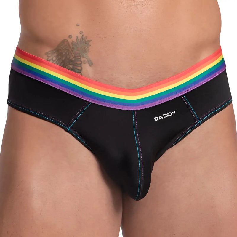 Close-up of black briefs featuring a rainbow striped elastic waistband against white.