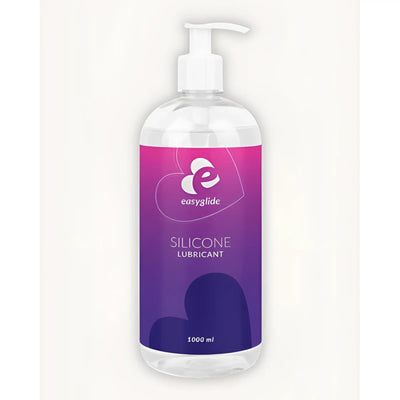 A clear plastic bottle of EasyGlide silicone lubricant with a white pump dispenser against a plain white background.