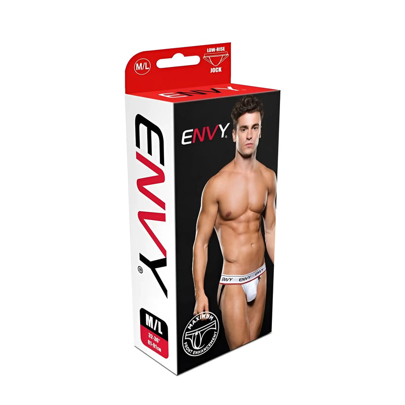 Shirtless man wearing white low-rise athletic briefs on black studio background setting.