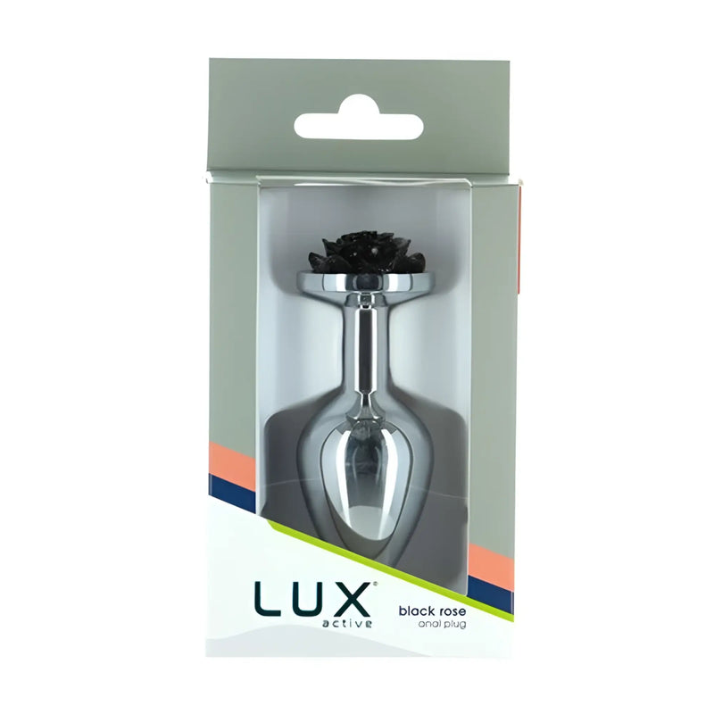 A polished silver metal object featuring a black rose in packaging box.