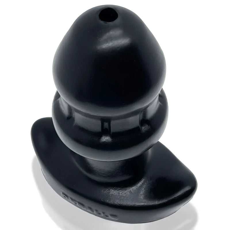 Smooth black bulbous silicone object with a wide base on white background.