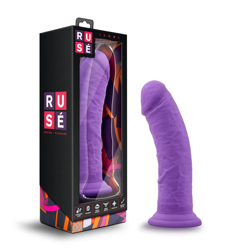 A textured purple phallic silicone object beside its tall black display box.