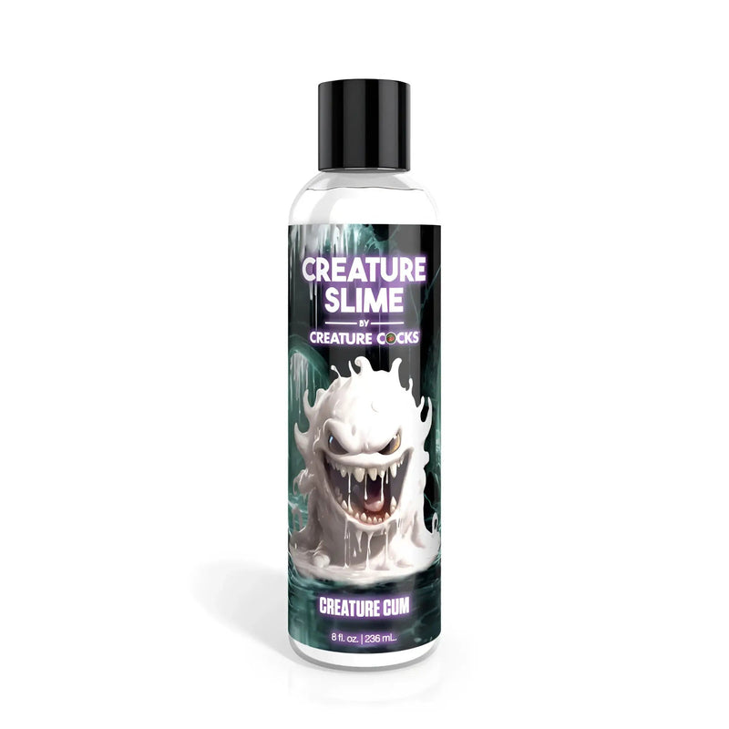 Clear plastic bottle with black cap containing liquid, white cartoon monster label.