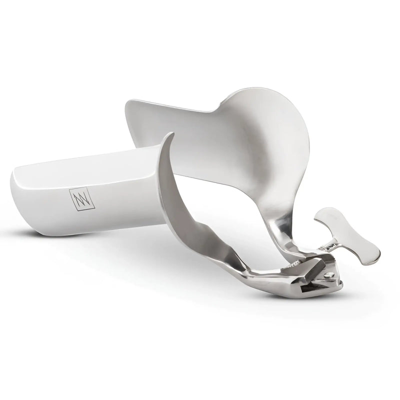 A silver coloured metal medical speculum isolated against a plain white background.