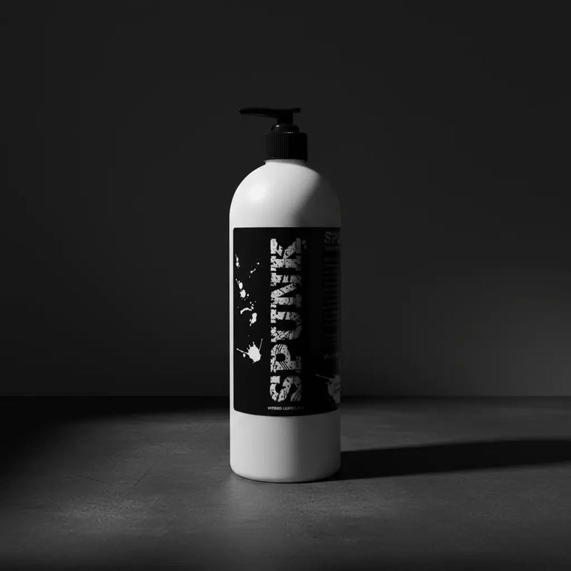 White plastic bottle with black pump dispenser and graffiti style spark label in the spunk lube collection.