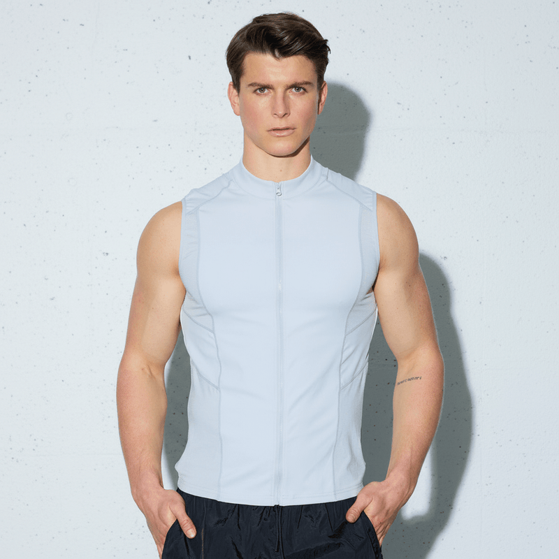 Light gray sleeveless athletic top with high collar and front zipper designed for active wear in coats and jackets collection