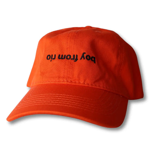 Orange cap with small black lettering.