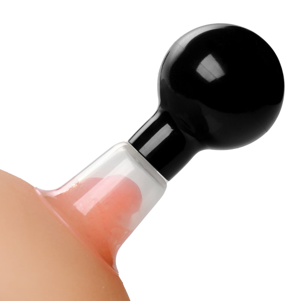 Close-up of black glossy adult nipple pump with rounded head for size stimulation and sensitivity enhancement, isolated on white background
