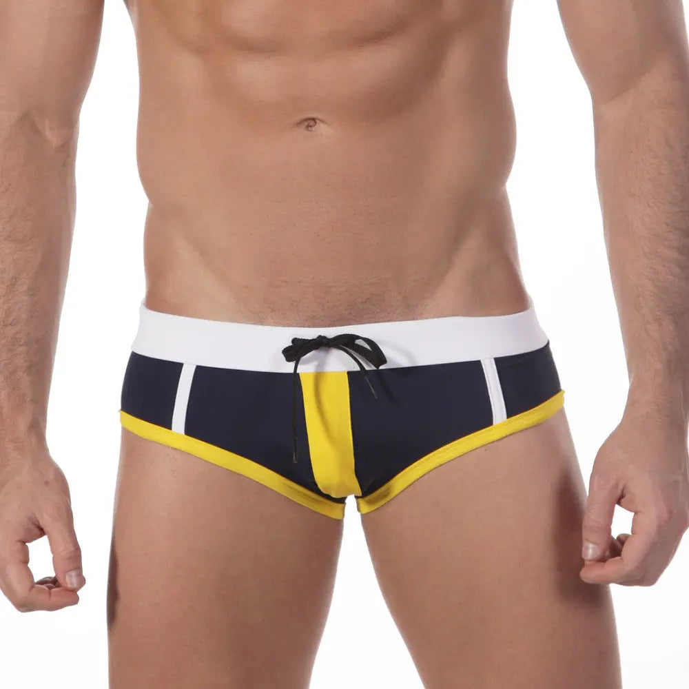 Close view of black, white and yellow briefs with a black drawstring.