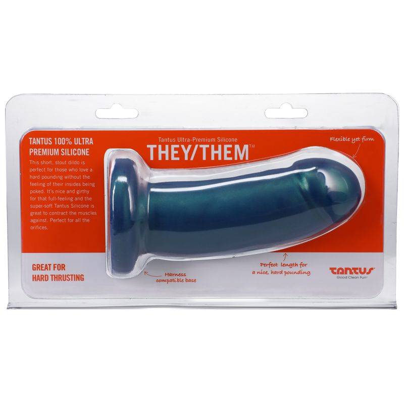 Packaging of Tantus They/Them Malachite dildo with clear plastic case, red and white label, and product details