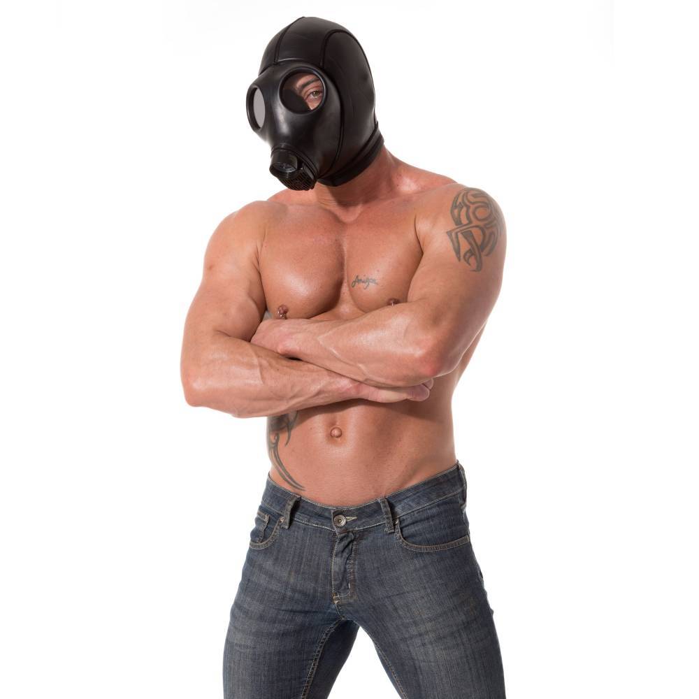 Man wearing black neoprene gas mask hood with eye holes, muscular torso, and crossed arms, designed for sensory deprivation and fetish play