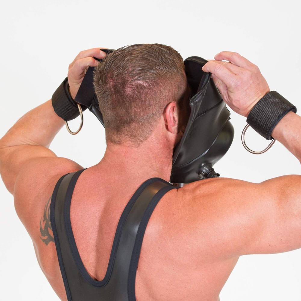 Adult male wearing a black BDSM neoprene gas mask hood with adjustable straps and metal D-rings, designed for sensory deprivation, on a plain white background - SKU: SF-9494
