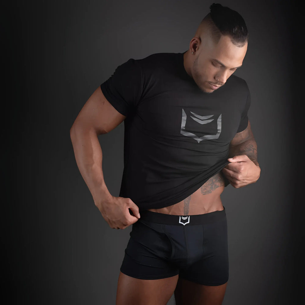 Black athletic t-shirt with silver geometric logo on chest paired with sheath 2.1 dual pouch trunks 3 pack bundle
