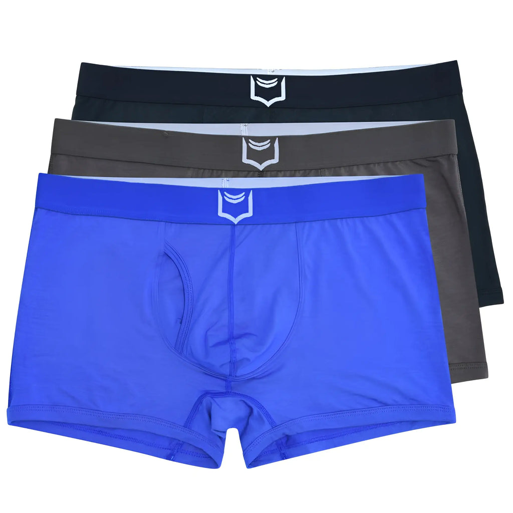 Set of three sheath 2.1 dual pouch trunks in vibrant blue charcoal gray and black with white shield logo waistbands
