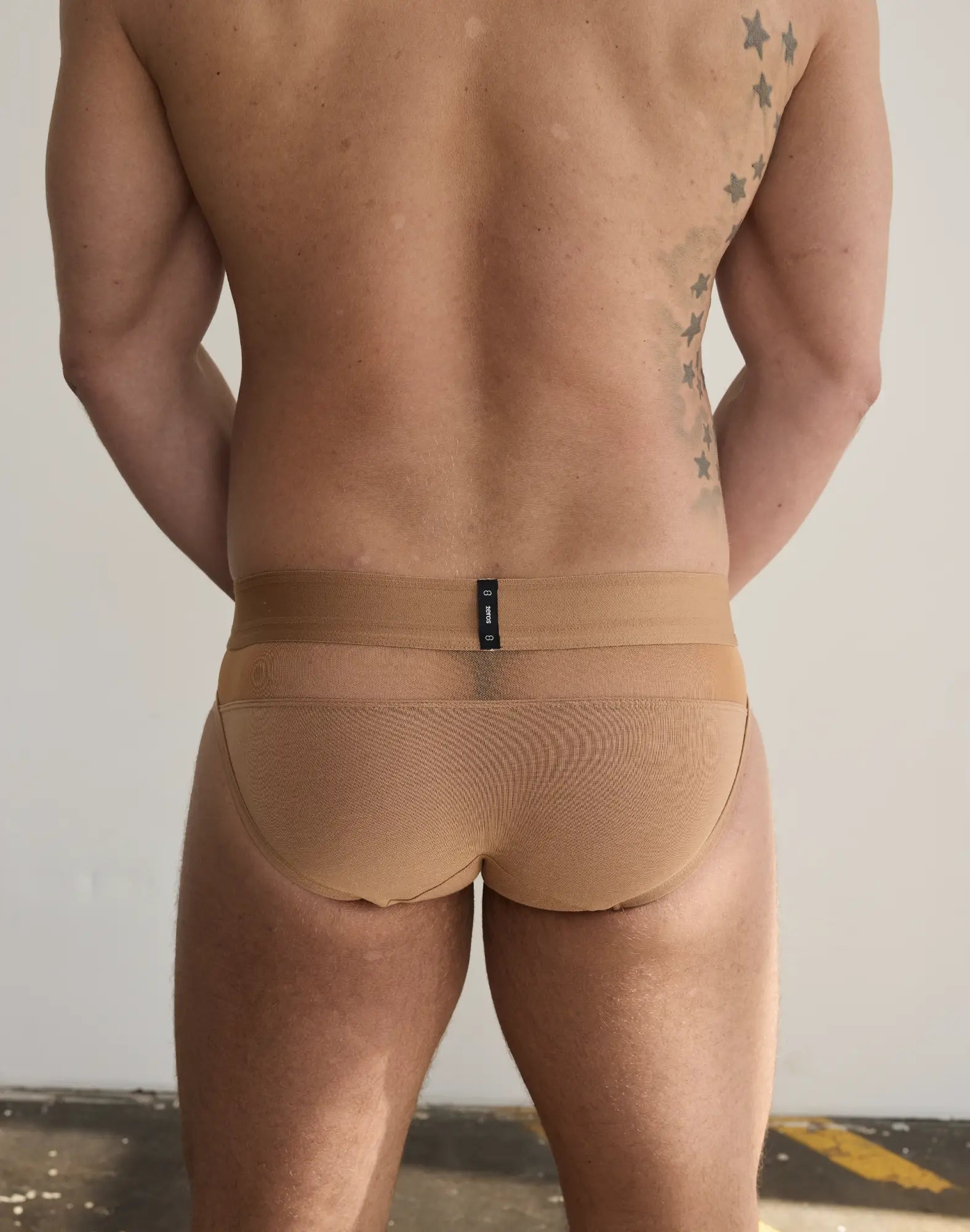 Tan 2eros morpheus brief underwear with textured mesh pattern and narrow waistband with black label