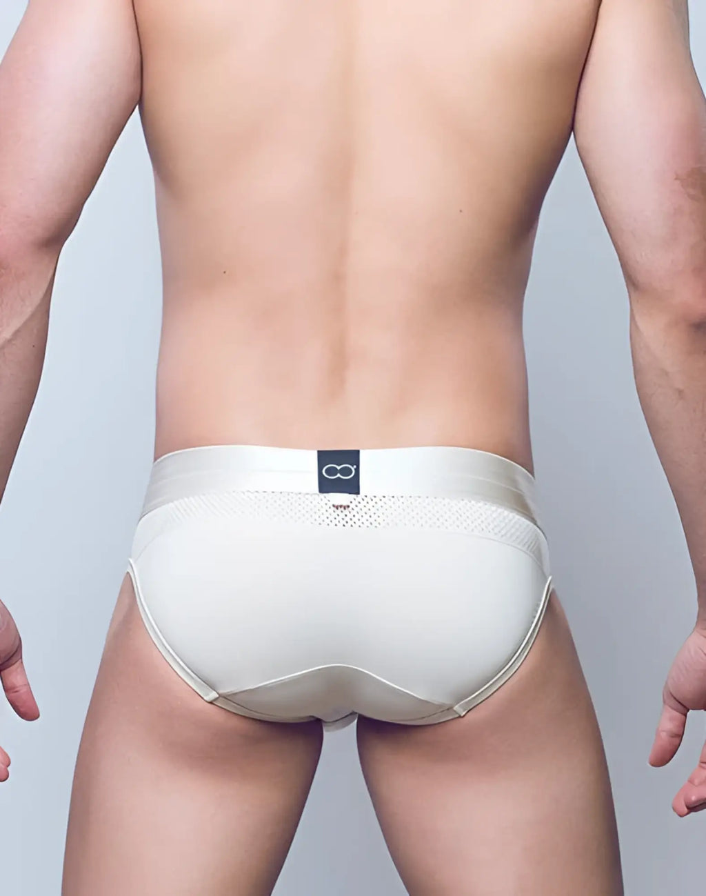 Cream-colored 2EROS AKTIV Boreas brief underwear with seamless design mesh panel and infinity logo tag in whitecap gray