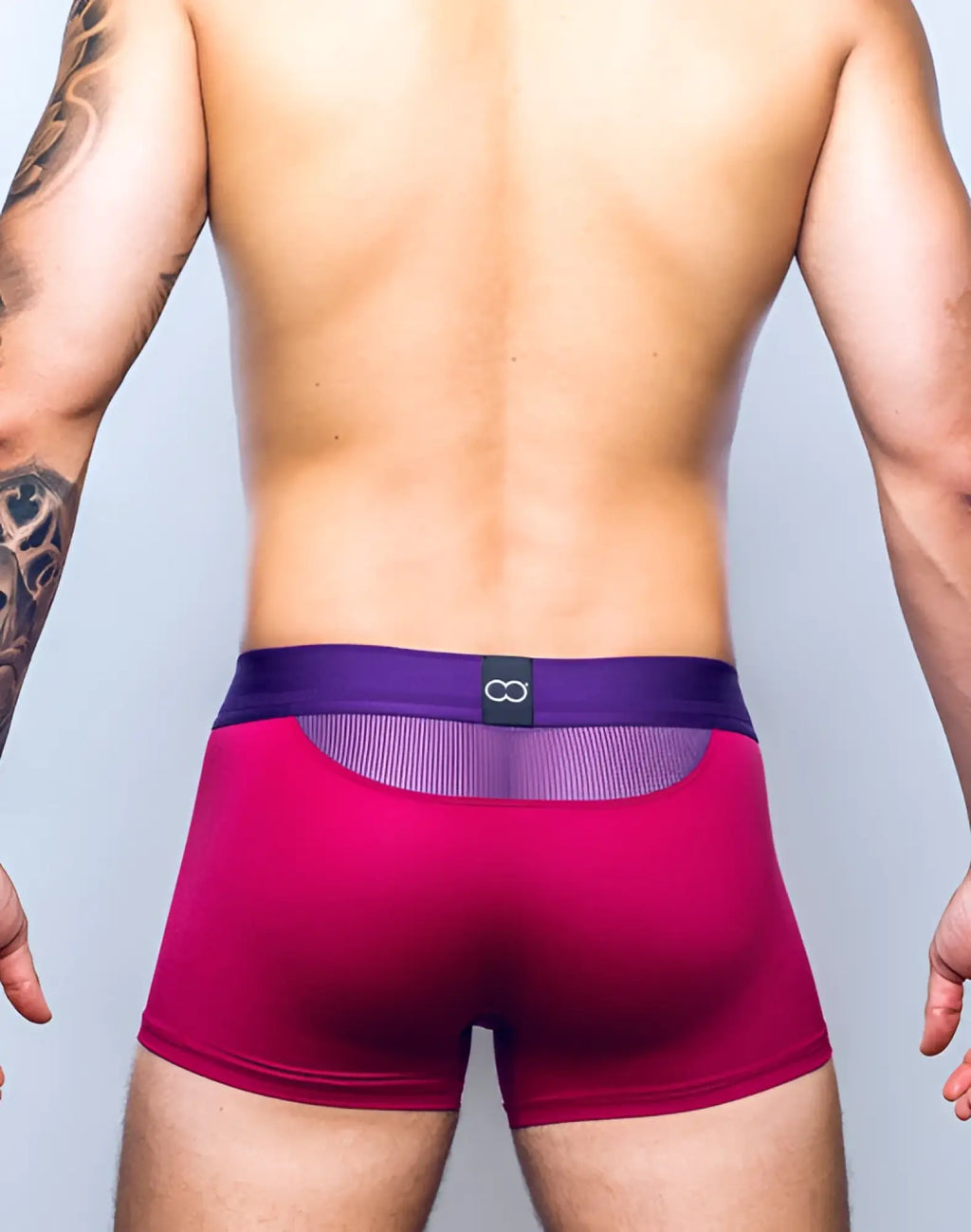 Purple and magenta 2eros aktiv cronus trunk underwear showing back mesh panel and black logo tag beet red color