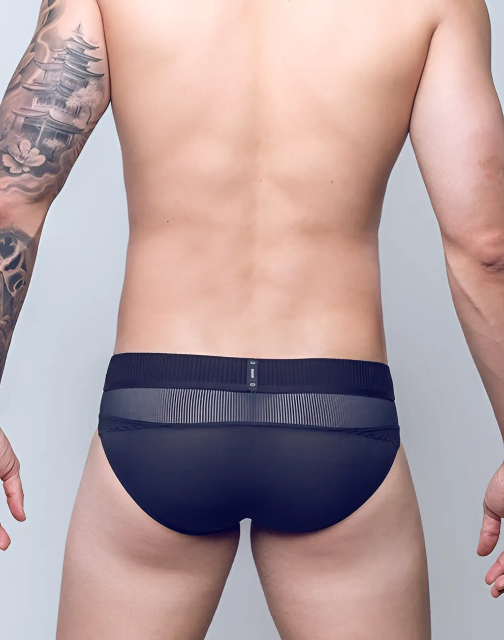 2EROS Aktiv Hermes brief underwear in black mesh with a textured waistband shown from the back side