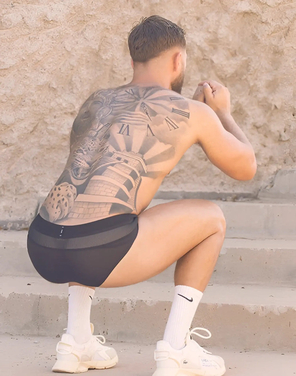 White nike sneakers with chunky sole and visible branding paired with 2EROS aktiv hermes brief underwear in black