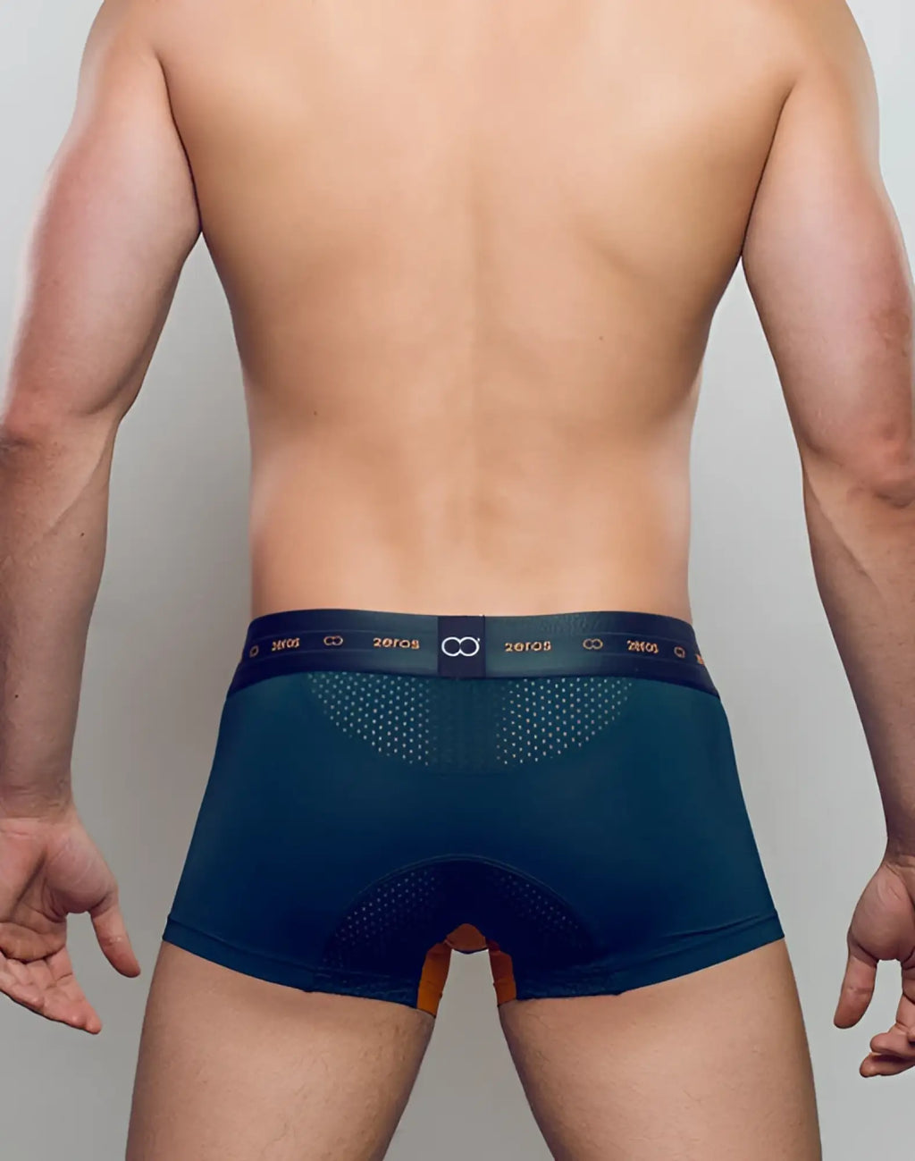 Back view of dark teal 2eros aktiv nrg trunk underwear with perforated mesh and orange accent panel