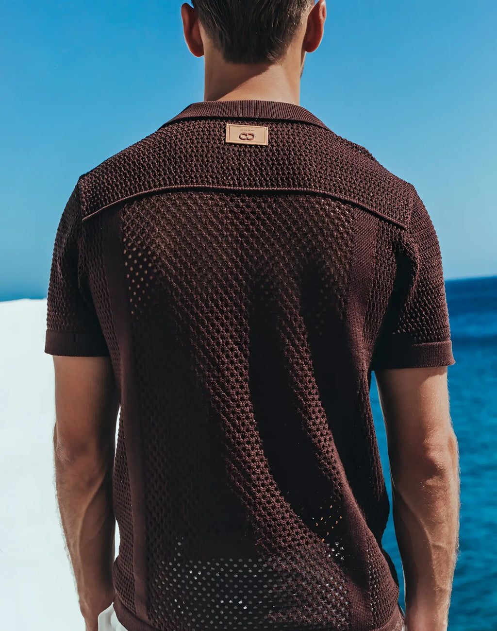 Brown textured knit polo shirt with subtle mesh pattern and leather brand tag on collar from 2EROS amalfi shirt carbon black