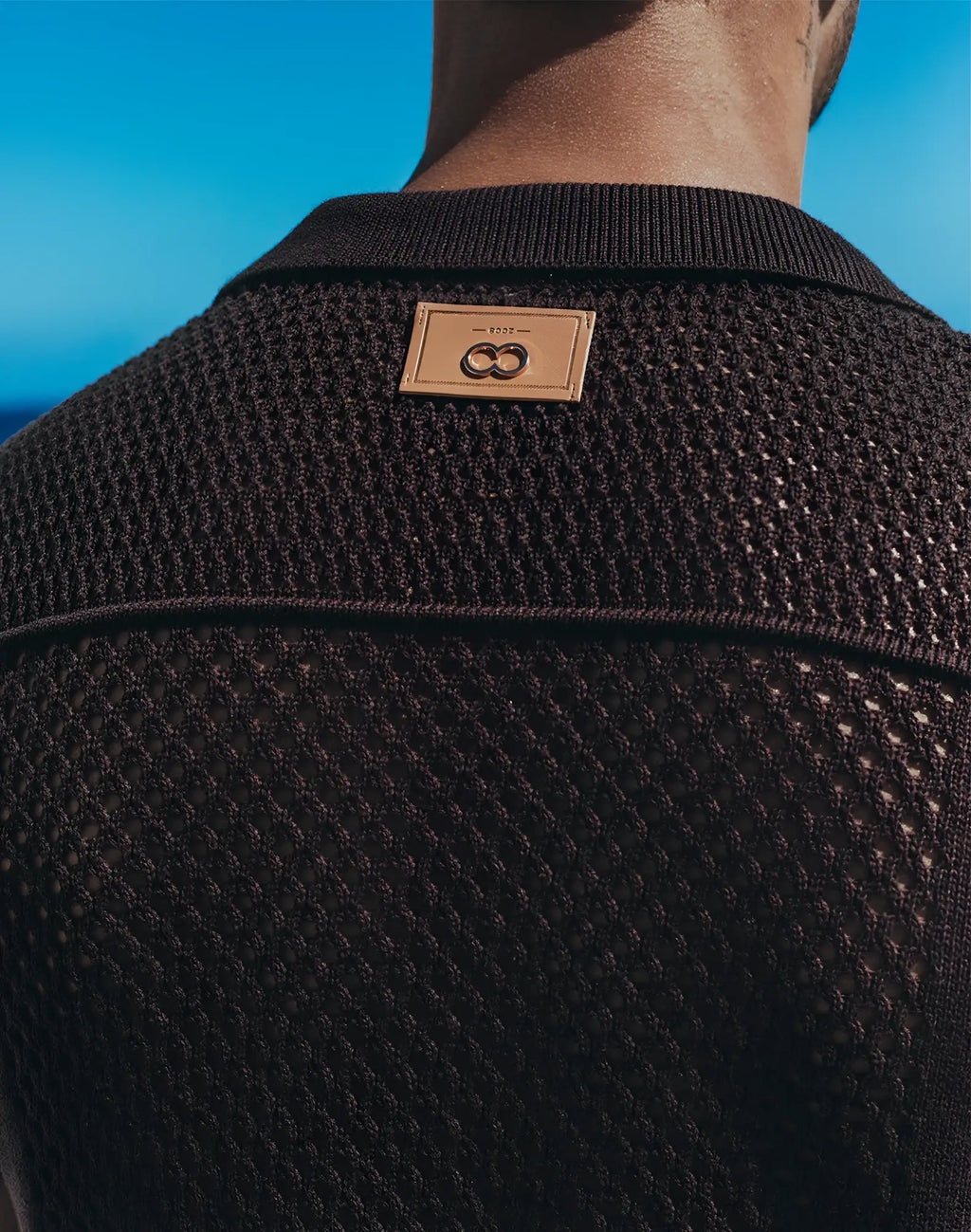 Black mesh knit 2EROS Amalfi shirt with tan leather patch at the neckline in carbon black color