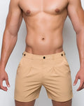 Beige 2EROS Avalon chino shorts with black button accents and a subtle brand logo on the lower right leg