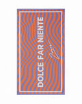A 2EROS beach towel with bold orange and purple wavy stripes and white dolce far niente text on a rectangular design