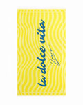 A vibrant yellow 2EROS beach towel with wavy stripes and la dolce vita in bold blue cursive for beach use