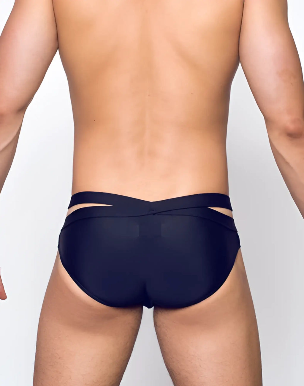 Black sleek swim trunks by 2eros with modern cut and cross-back design shown from the back side