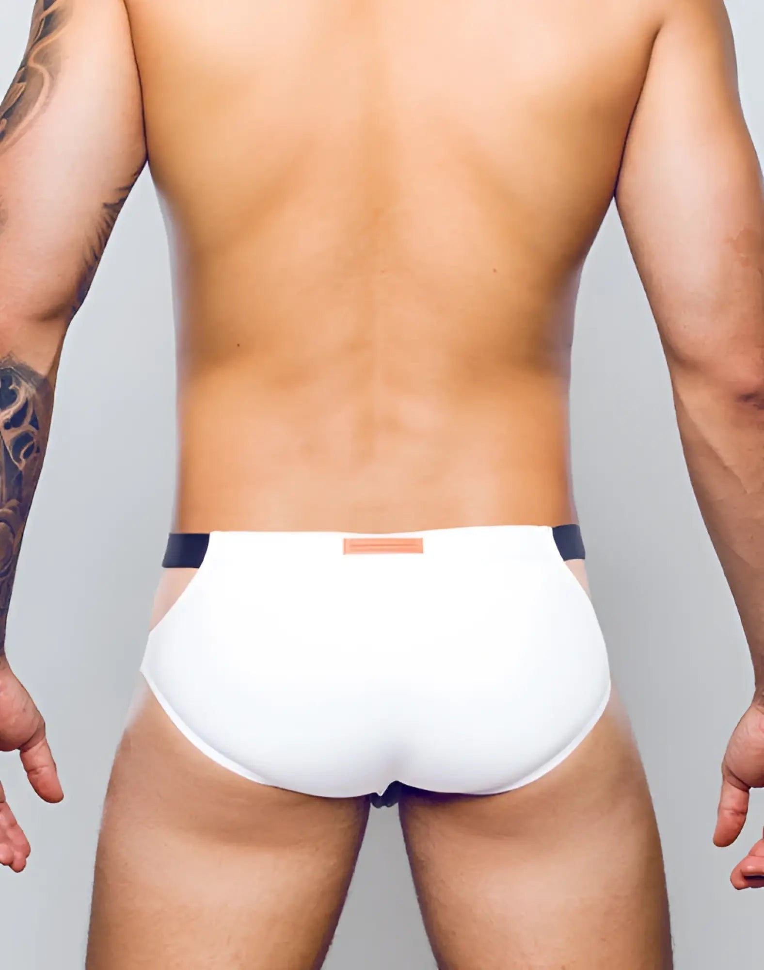 White 2eros blk label no5 swim brief with black trim and small orange tag at waistband in black and white
