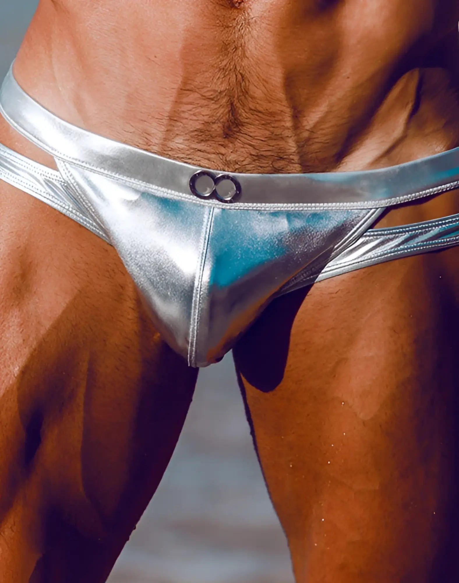 2EROS BLK Label No.5 swim brief in shiny silver metallic with sleek design and black circular accents at the front