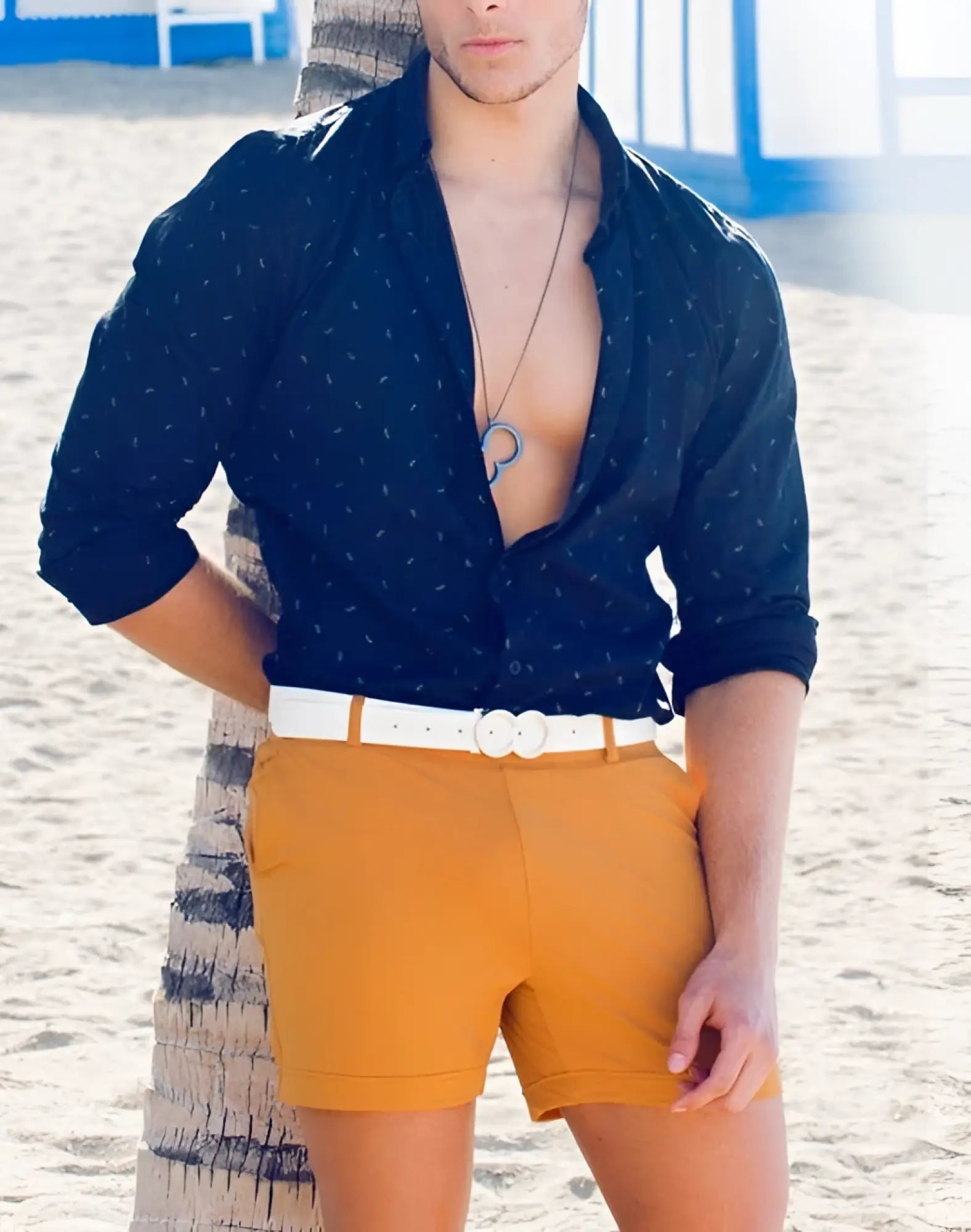 A white double-button belt worn around the waist with 2eros bondi shorts in almond color