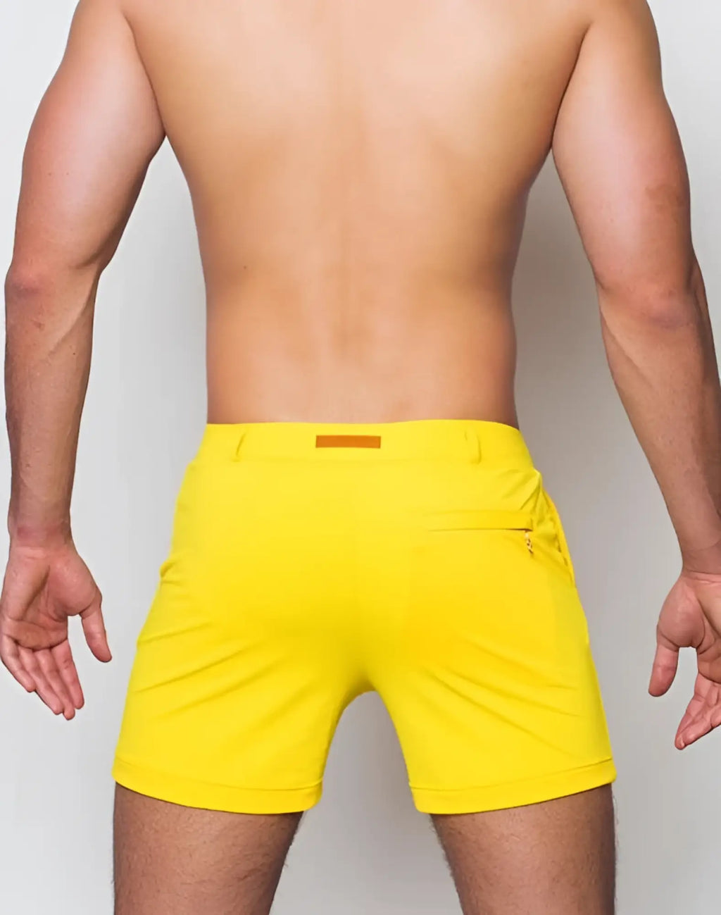 2eros bondi shorts series 2 in bright yellow athletic fabric with a subtle orange waistband detail for activewear