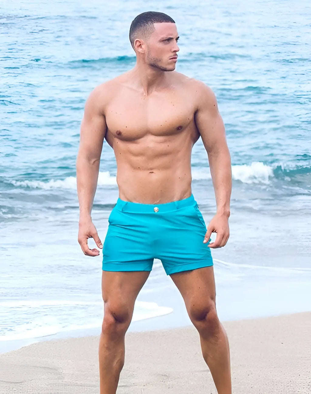 Bright turquoise 2eros bondi shorts series 3 with subtle metallic button at waistband for swimwear use